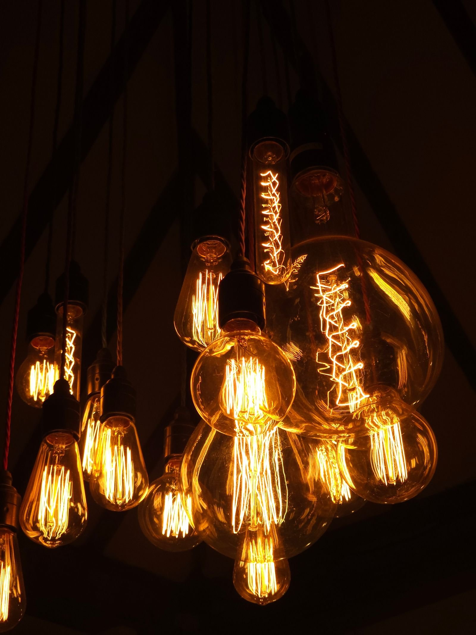 Glowing Edison bulbs hanging together for warm vintage lighting