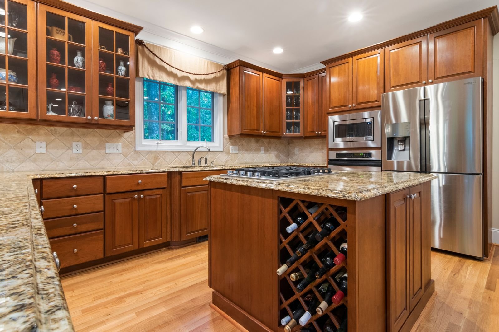 Kitchen with warm wooden cabinets and granite countertops