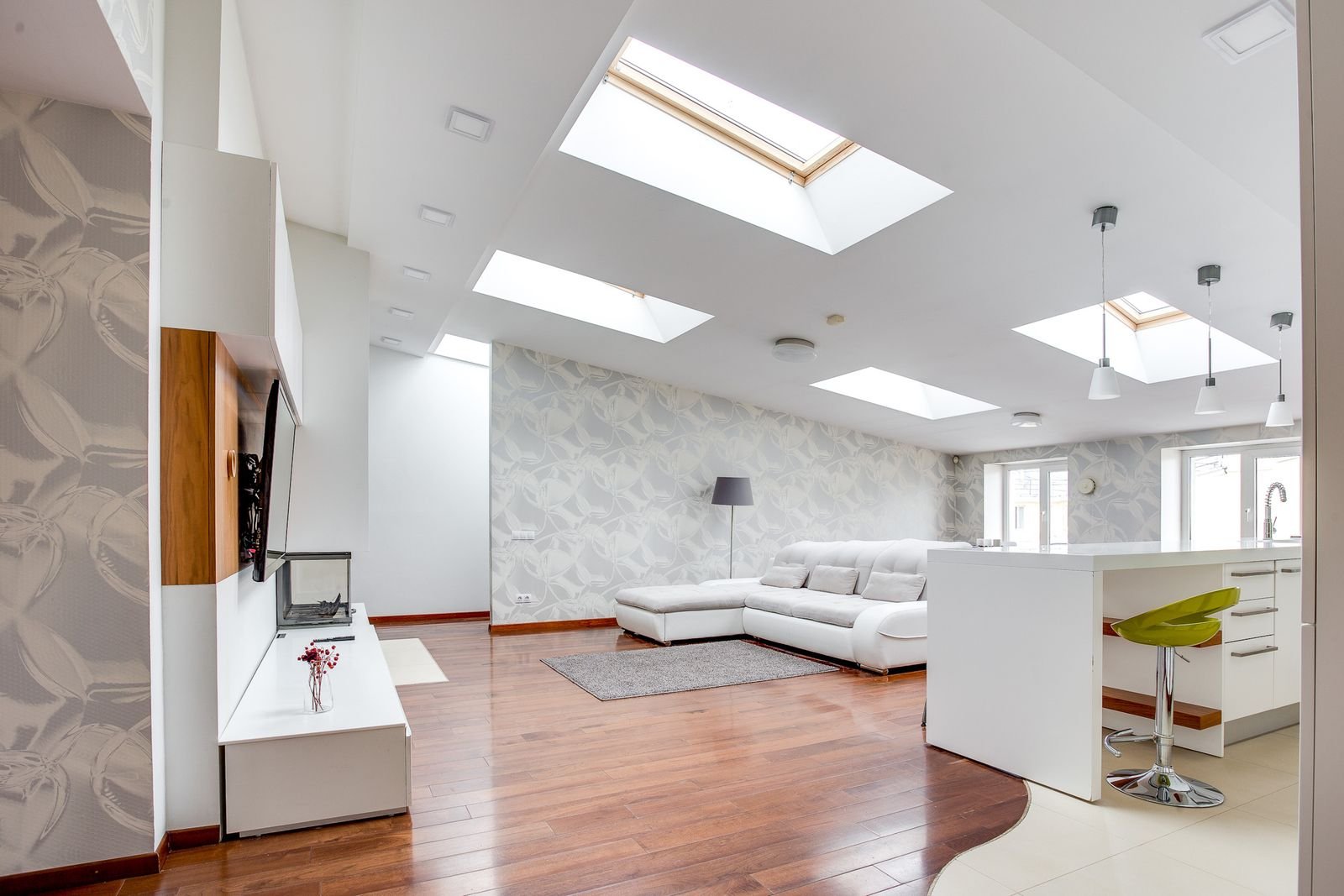Bright living room with roof skylights letting in natural light