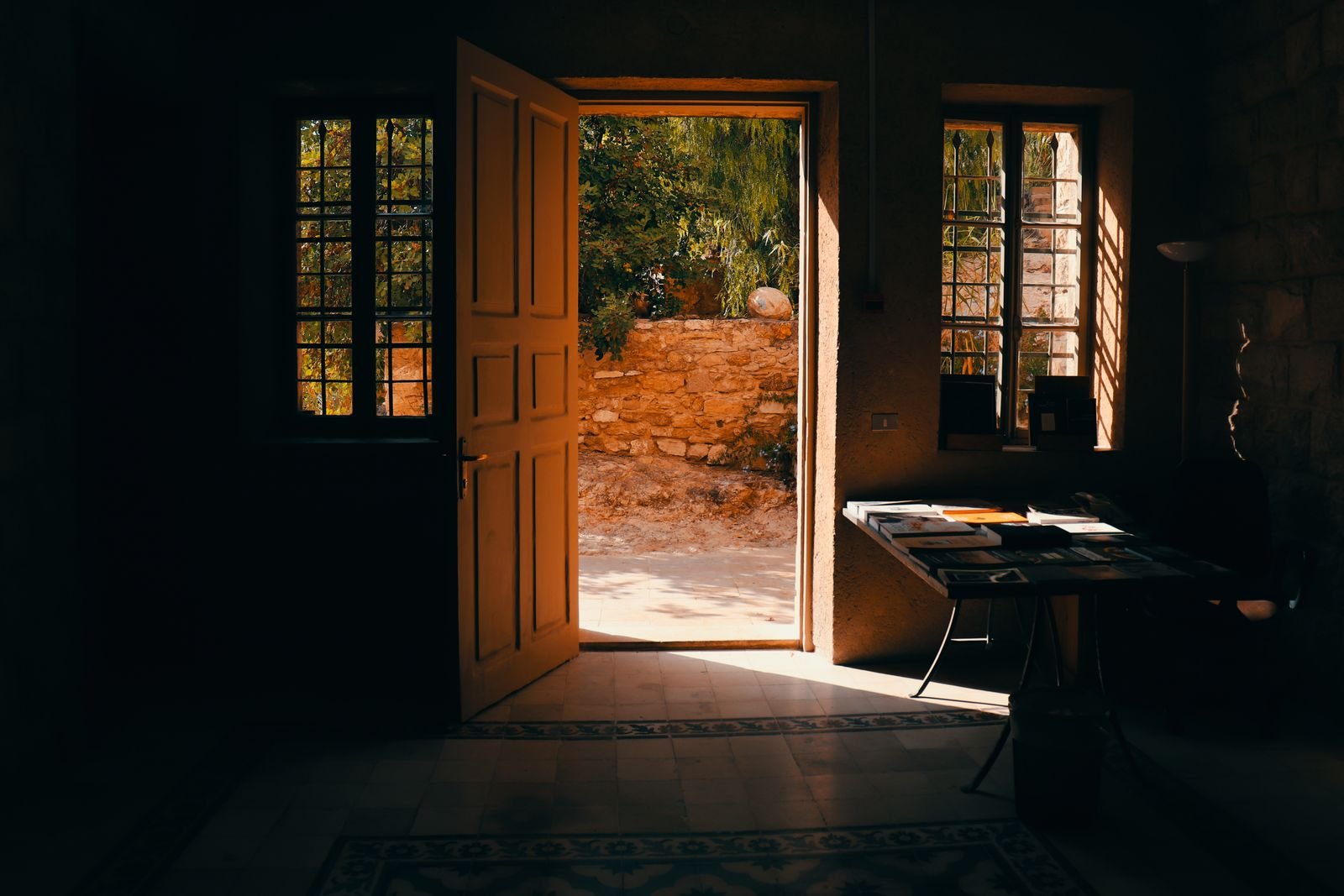 Open interior door letting warm sunlight into a home
