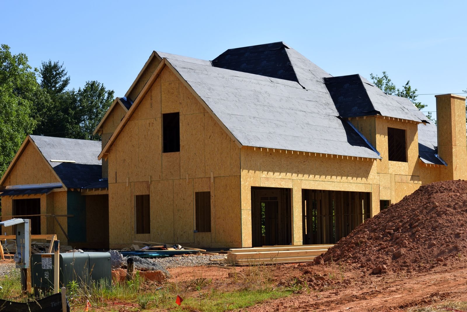 Wooden frame of a two-storey house under construction