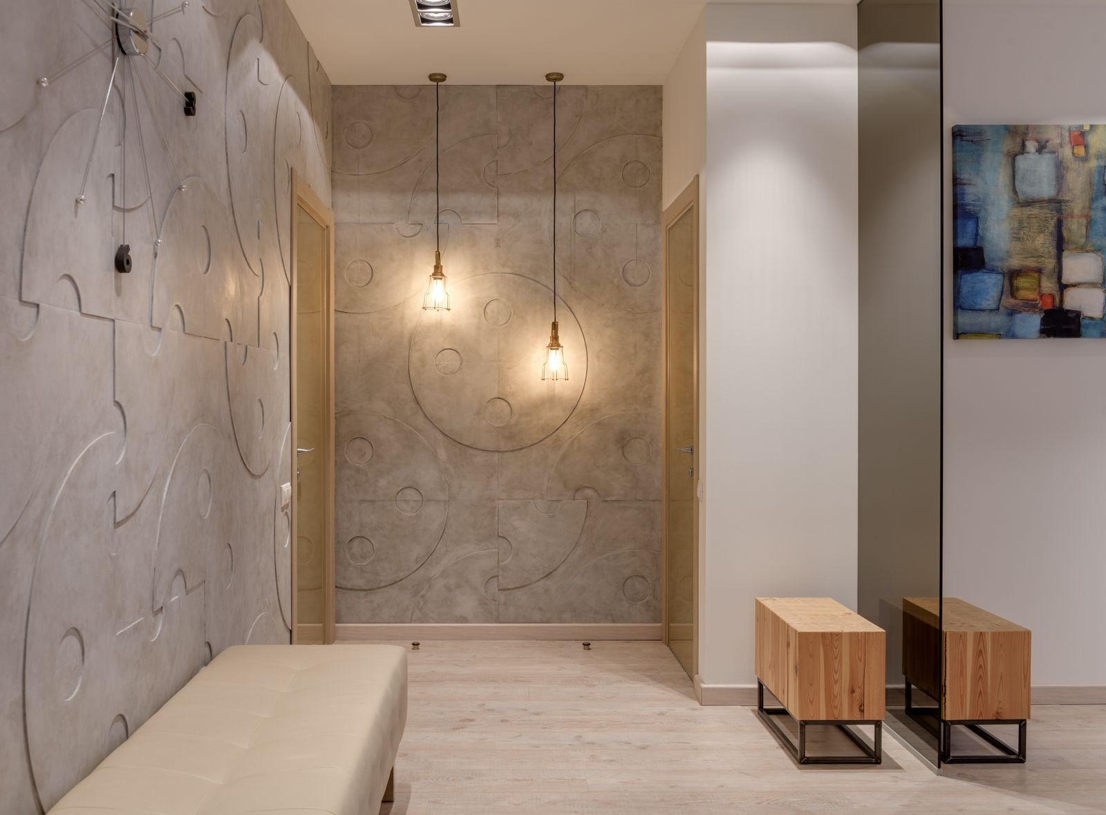 Entry hall with pendant lamps glowing against textured walls