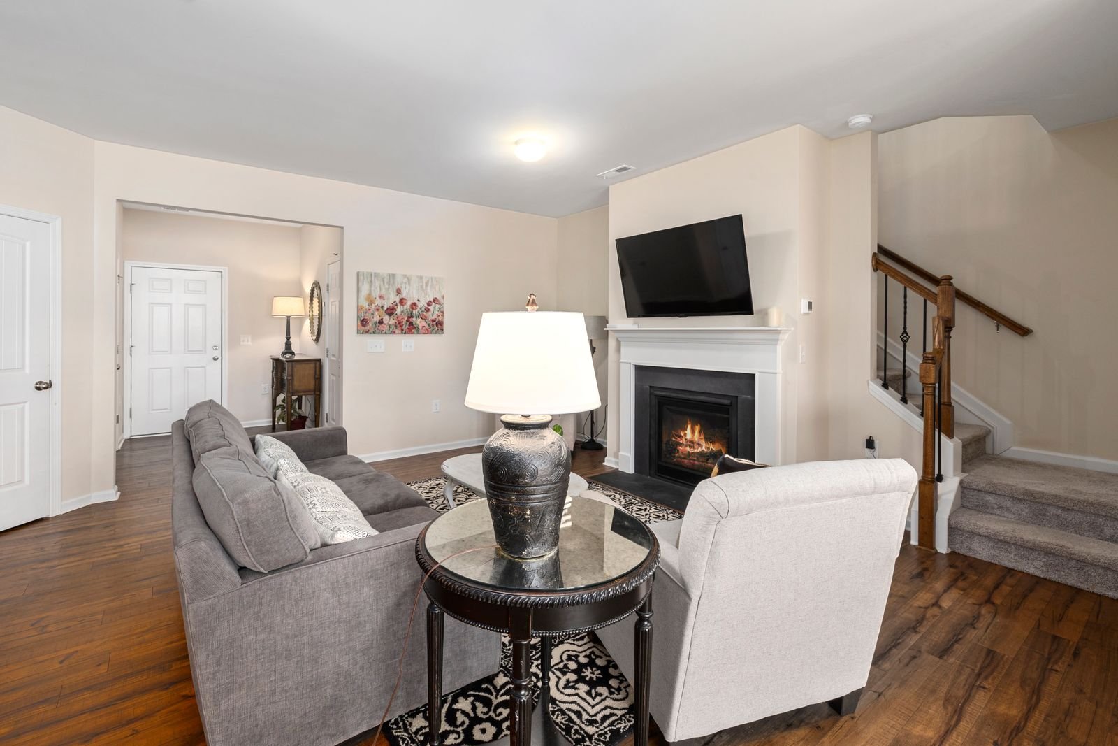 Cozy living room with a fireplace and modern decor.