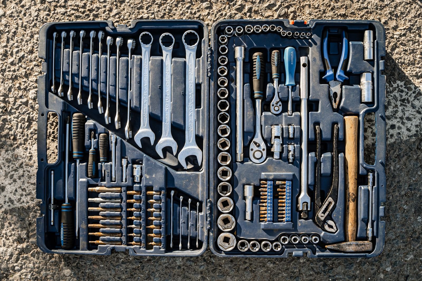Open toolbox with an organized set of essential hand tools.