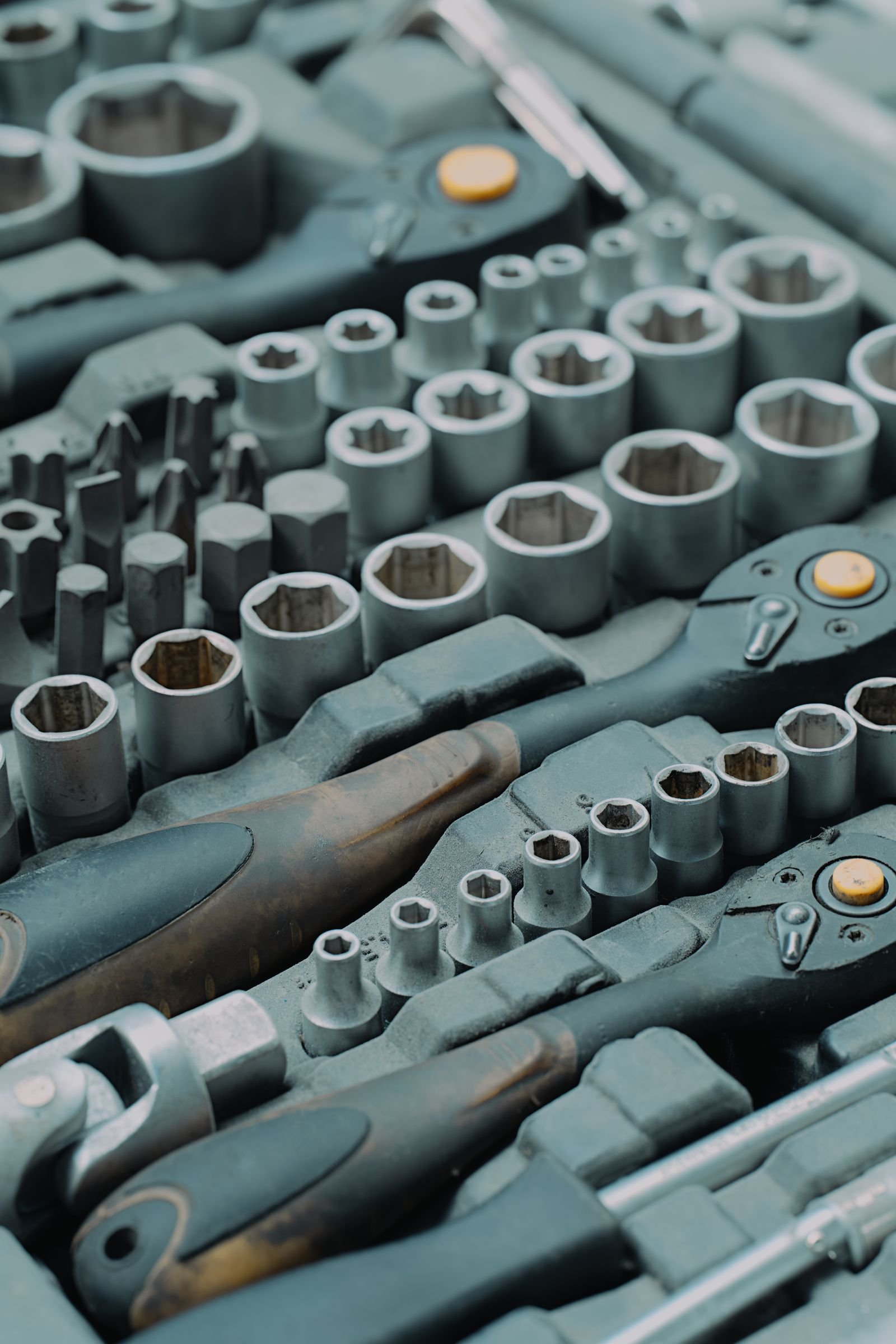 Ratchet and socket tool set laid out in its case.
