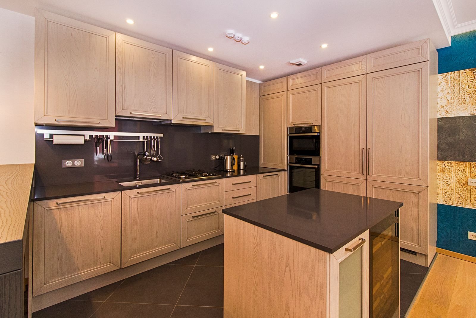 Contemporary kitchen with wooden cabinets and a sleek island.
