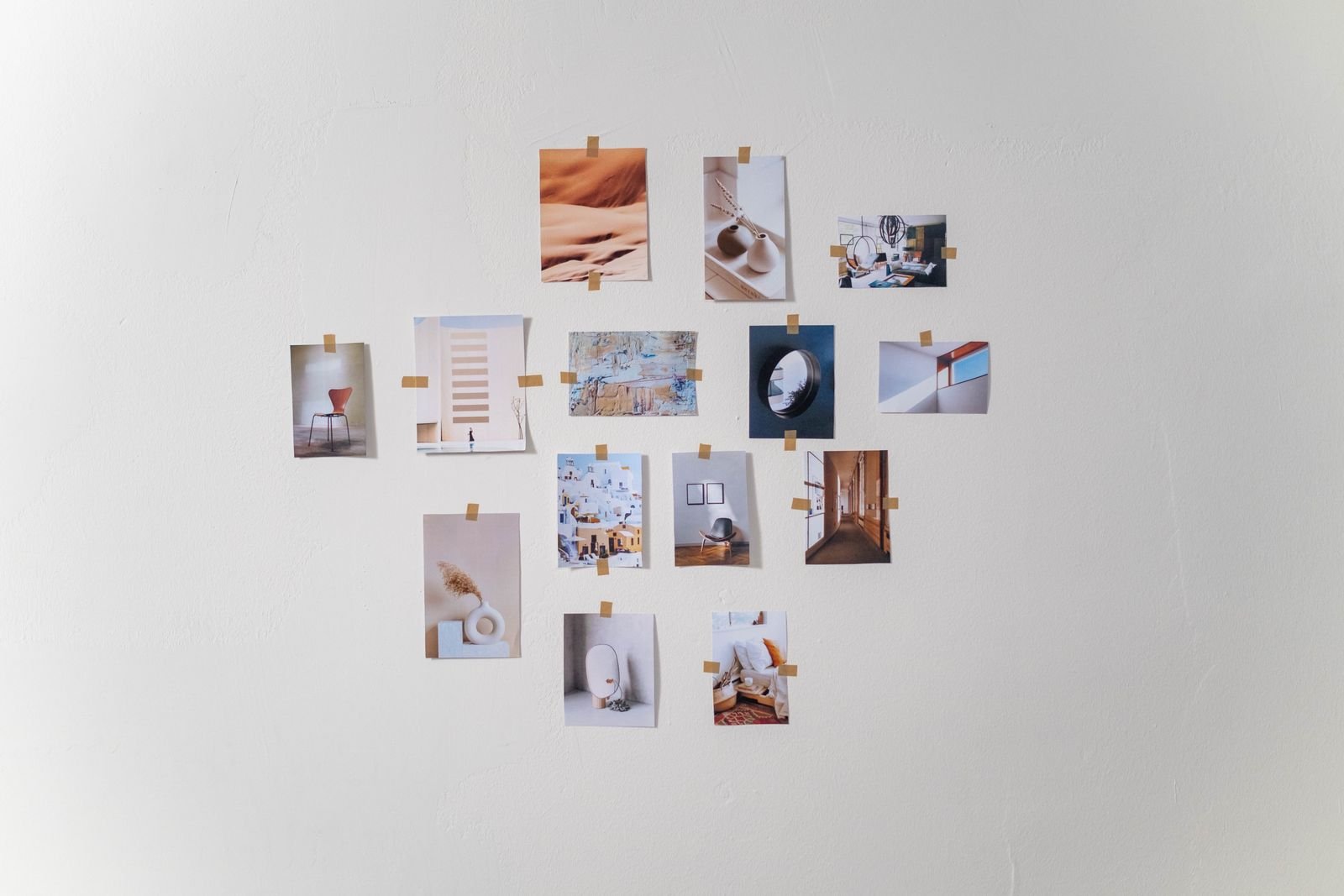 Photos arranged in a simple grid on a white wall.