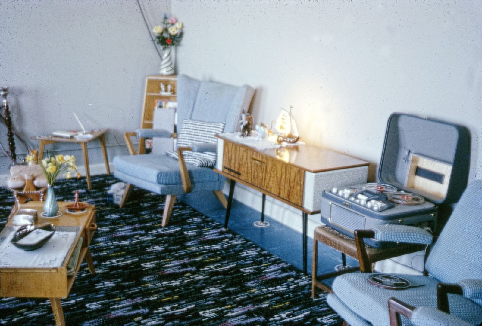 Mid-century modern living room with vintage furniture and decor.