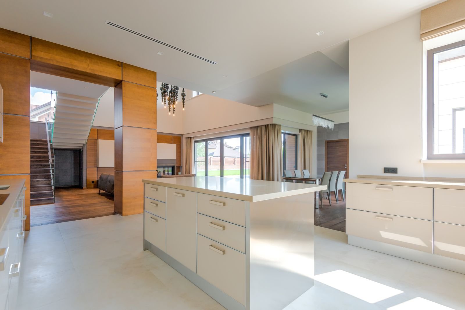 Spacious minimalist kitchen filled with natural light.