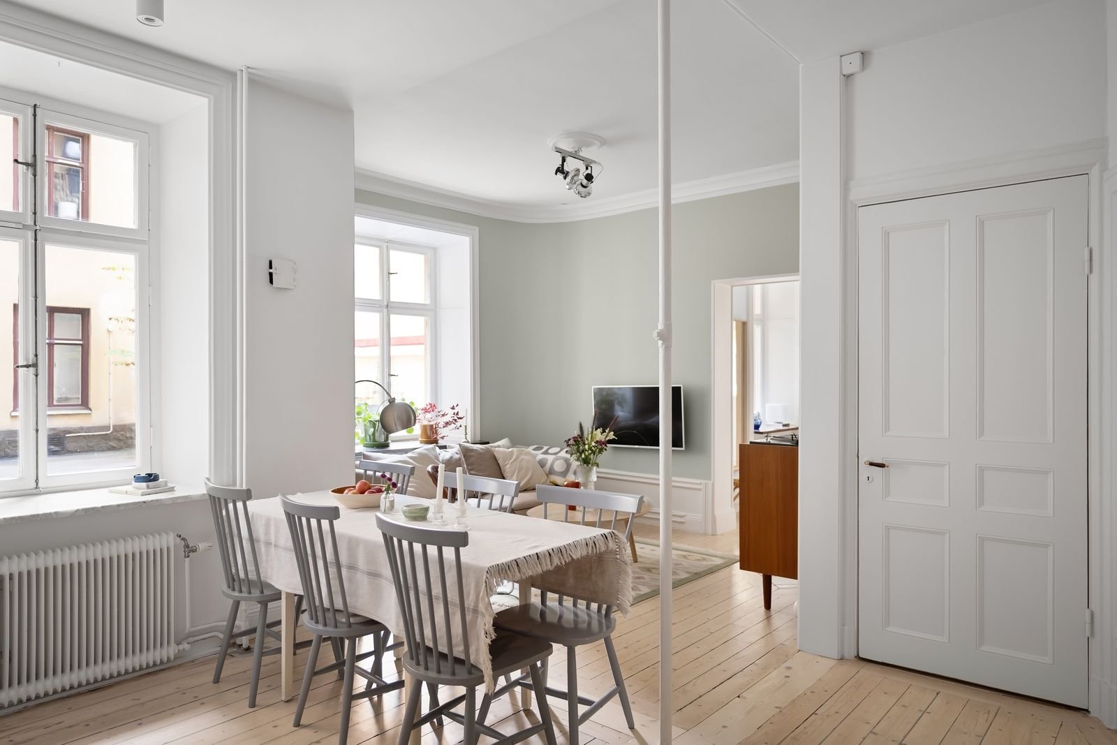 Spacious Scandinavian-style living and dining area in natural light.