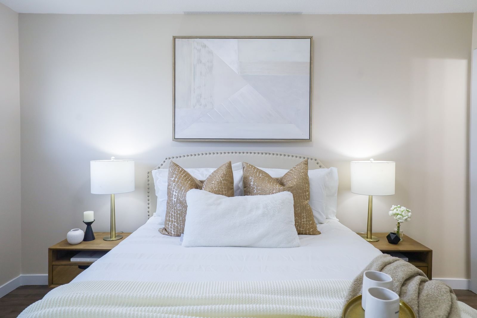 Cozy bedroom with modern decor in a neutral color palette.