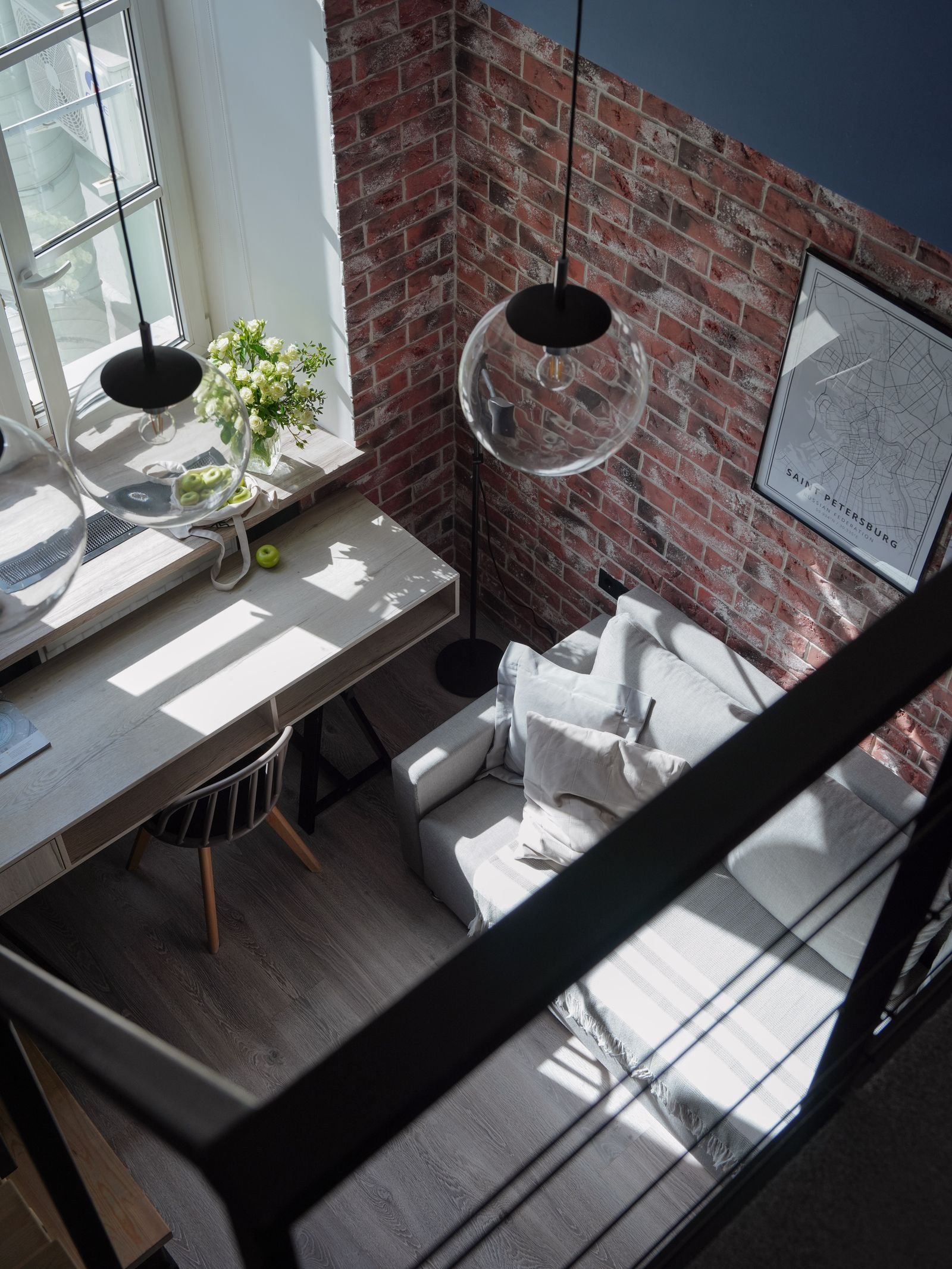 Bright modern loft with brick walls and contemporary furniture.