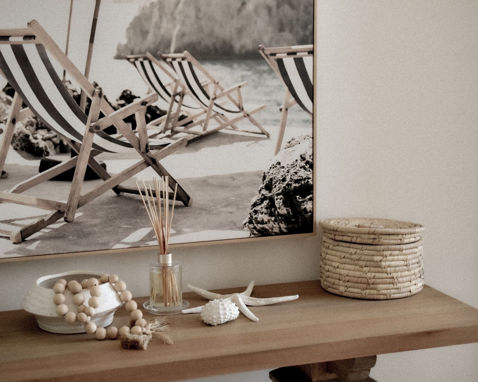 Minimalist living room with beach-themed decor and bamboo pieces.