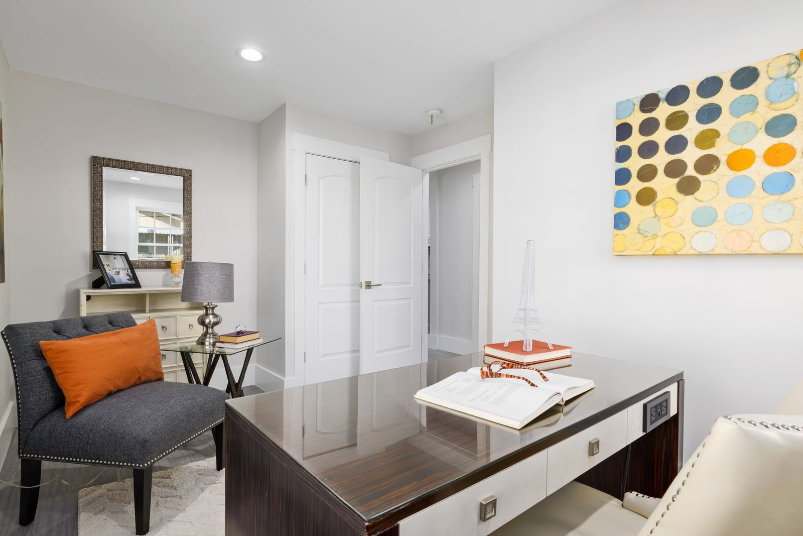 Bright modern home office with stylish furniture and decor.