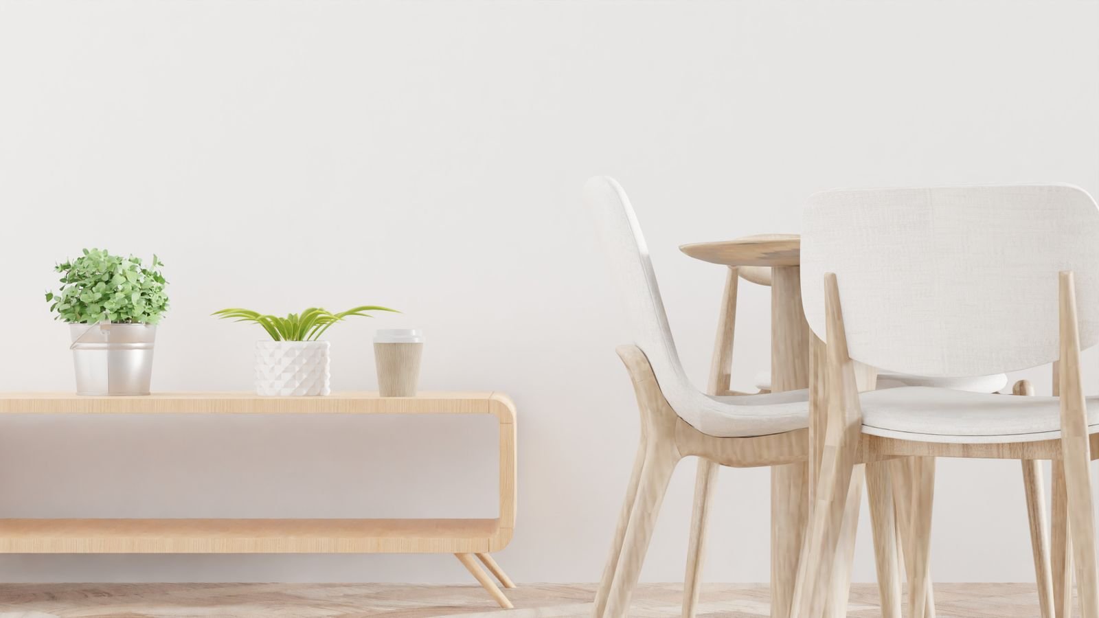 Dining area with light wooden furniture and indoor plants.