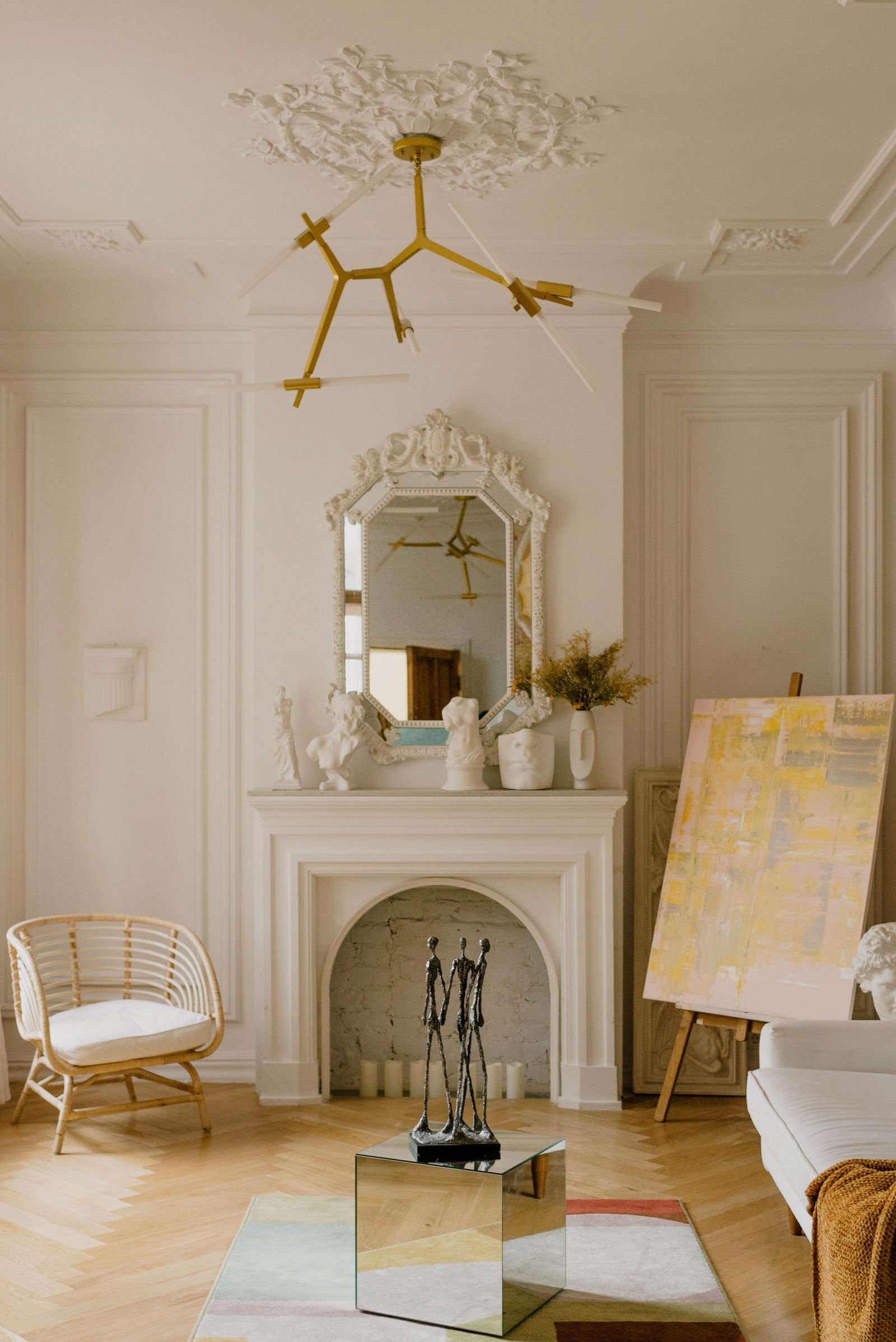 Classic luxury living room with a fireplace and art on the walls.