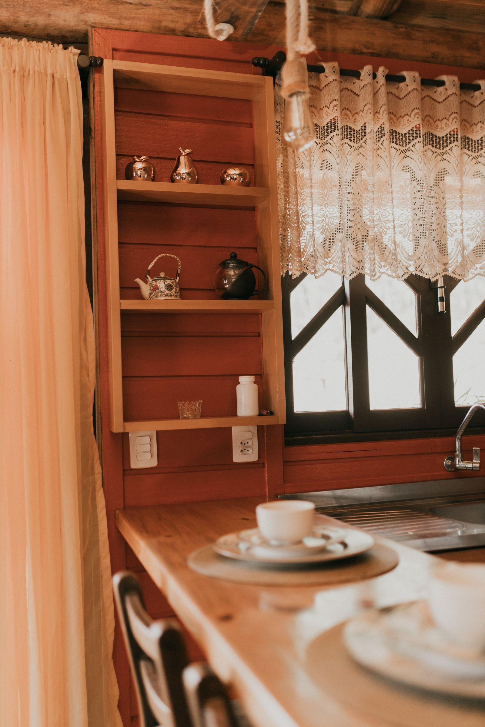 Cozy rustic kitchen with vintage decor and soft natural light.