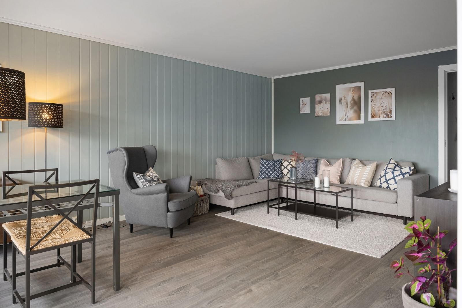 Sleek gray living room with modern furniture and decor.
