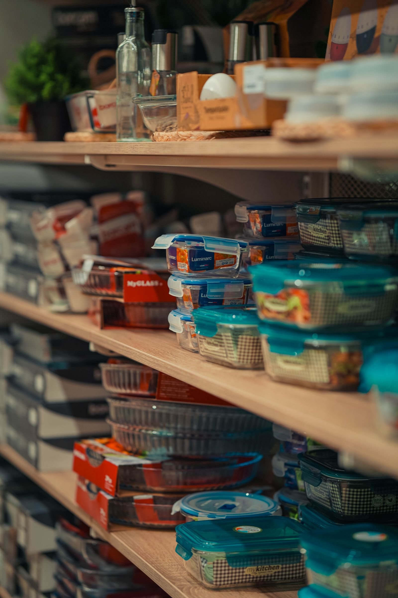 Pantry shelves with neatly arranged storage containers.