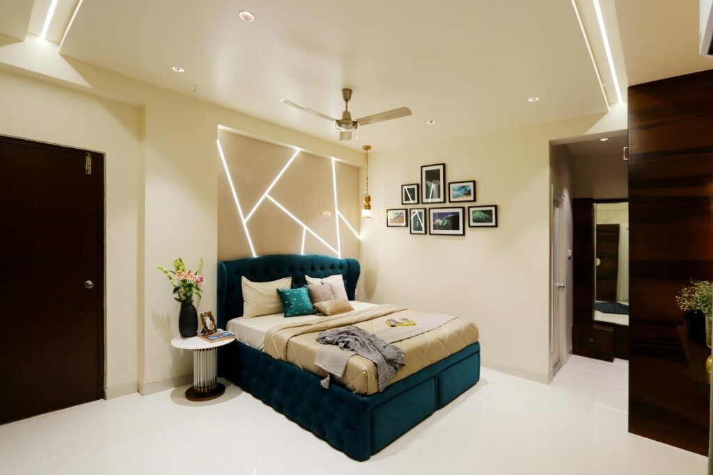 Stylish bedroom with cozy bed, geometric paneling, and artistic decor. Ideal for luxury home inspiration.