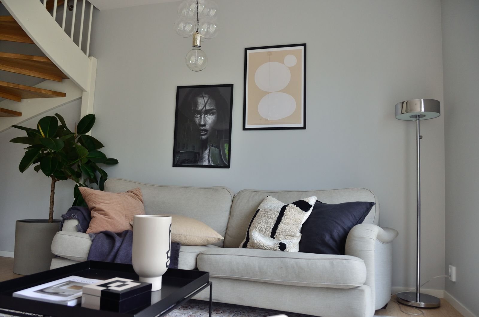 Cozy Scandinavian living room with a comfortable sofa and simple decor.
