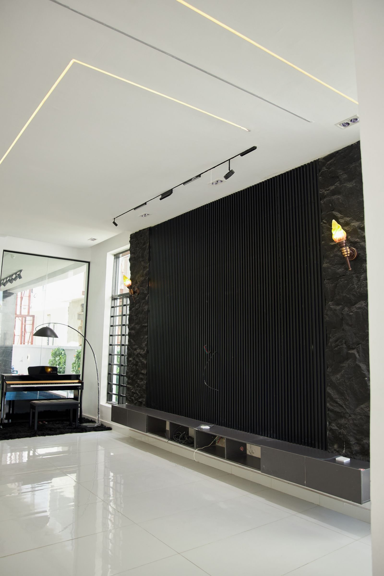 Modern living space with a bold black accent wall