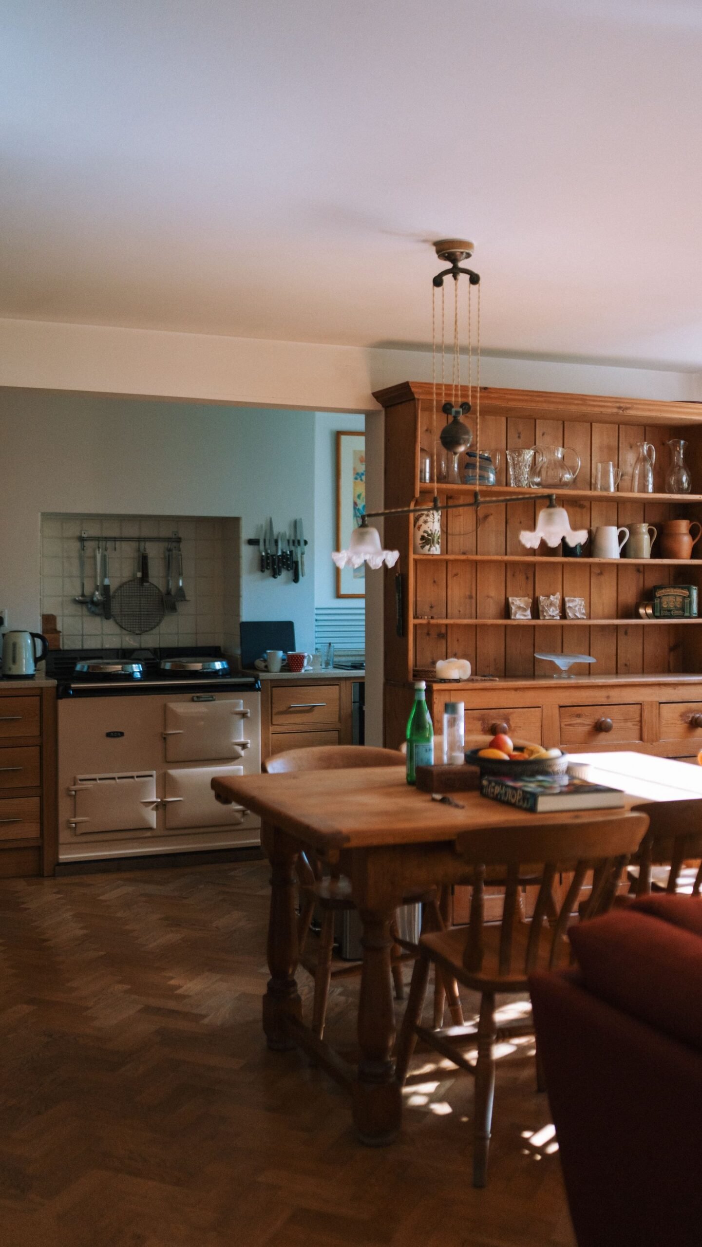Rustic kitchen with a wooden dining table and vintage decor.