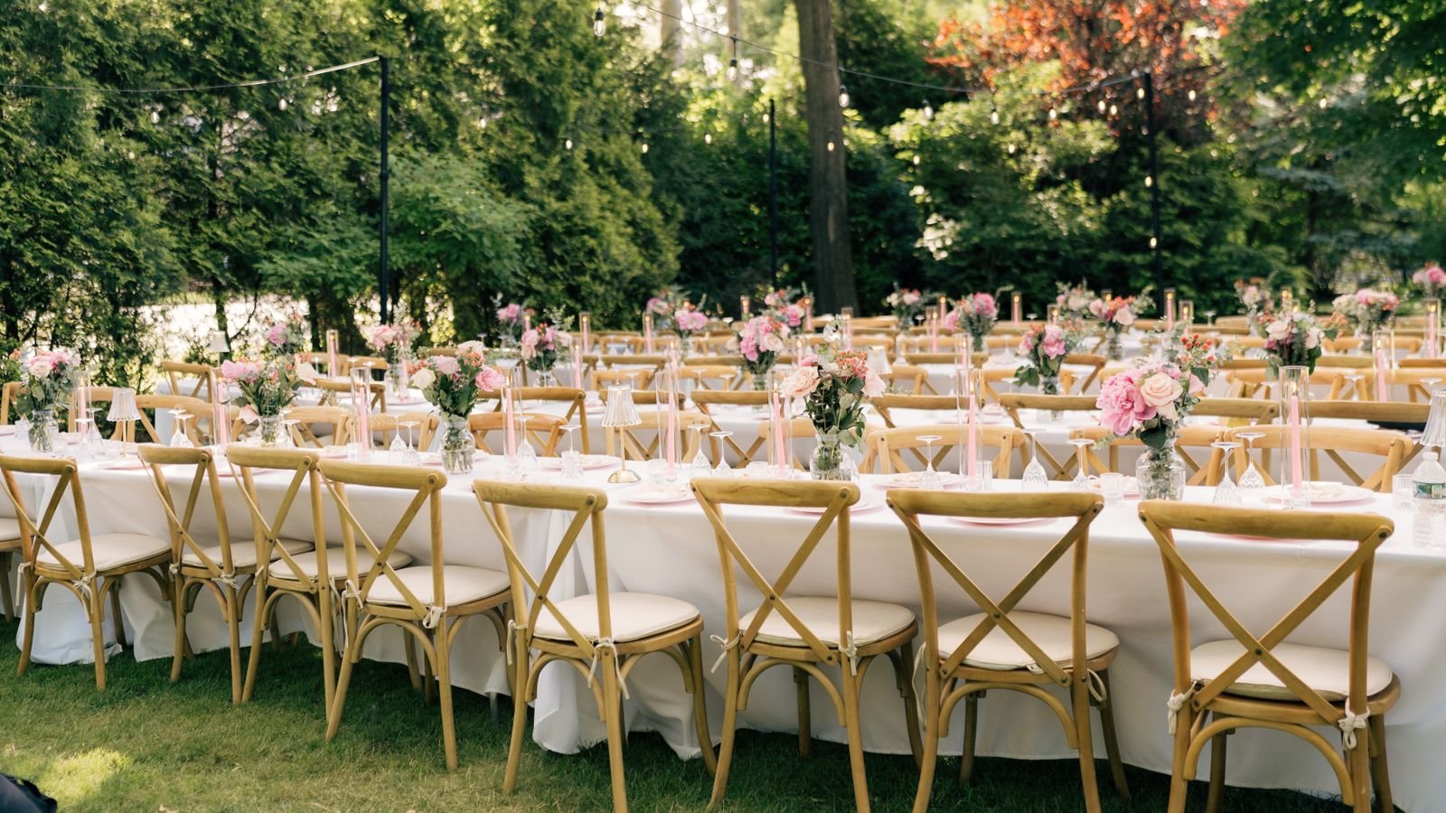 Wedding tables and chairs decorated for an outdoor garden celebration