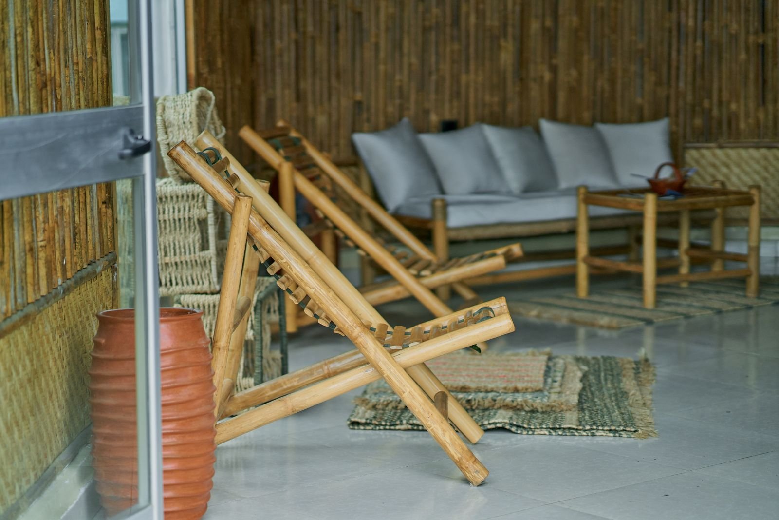 Bamboo furniture in a cozy indoor lounge, a renewable material for eco-friendly decor
